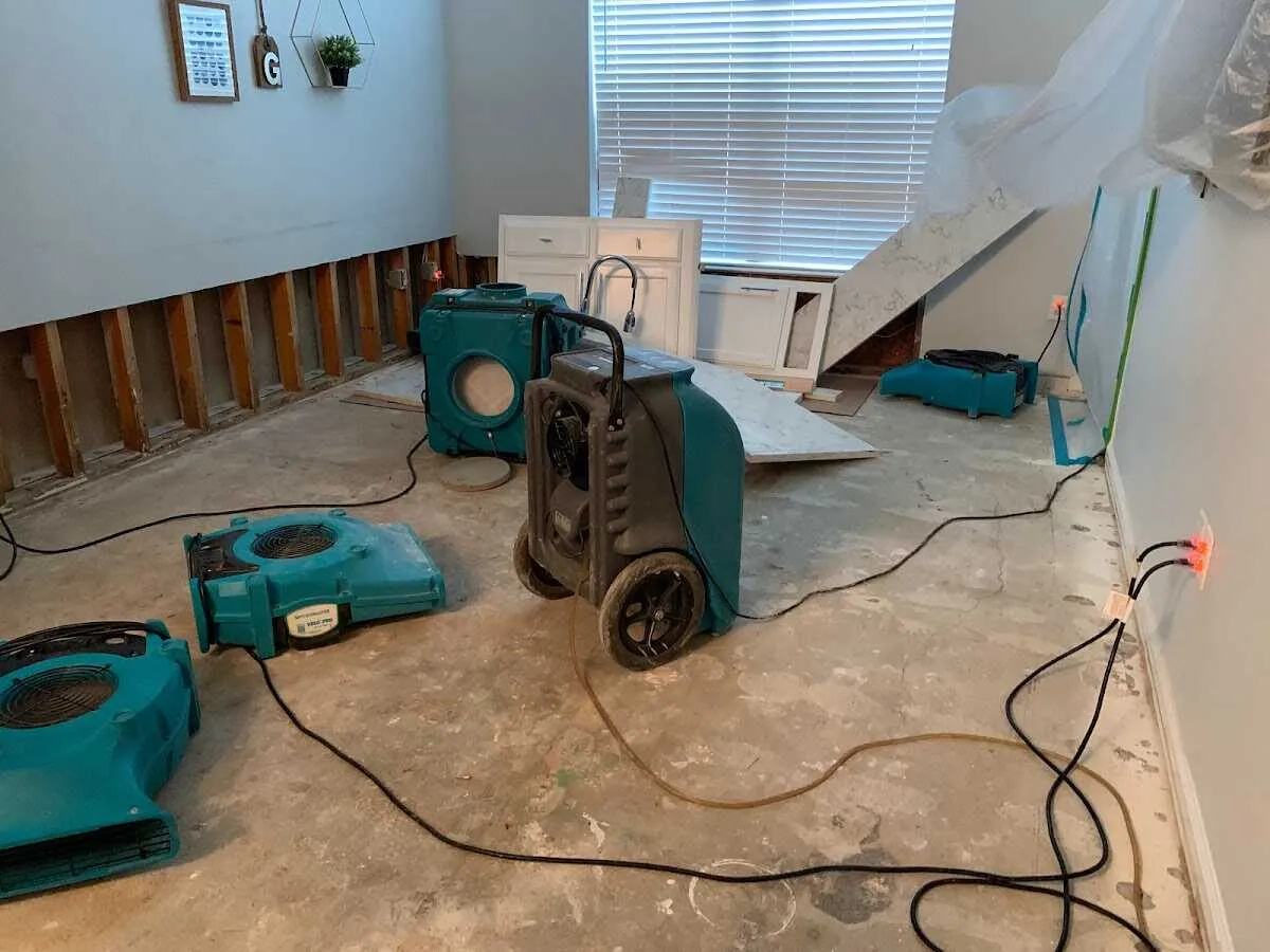 Dehumidifier in flood-cut room for Water Damage Restoration in Harrah